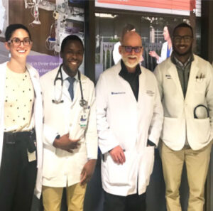 Dr. Chris Mwaniki (second from left) as a visiting observer at Duke with Dr. Peter Kussin (third from left)